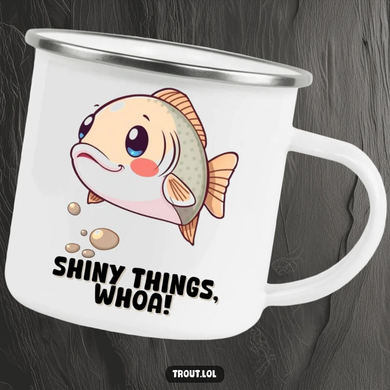 Funny enamel camping mug showing a trout with a comically surprised expression as a shiny pebble rolls by, a humorous and sturdy companion.