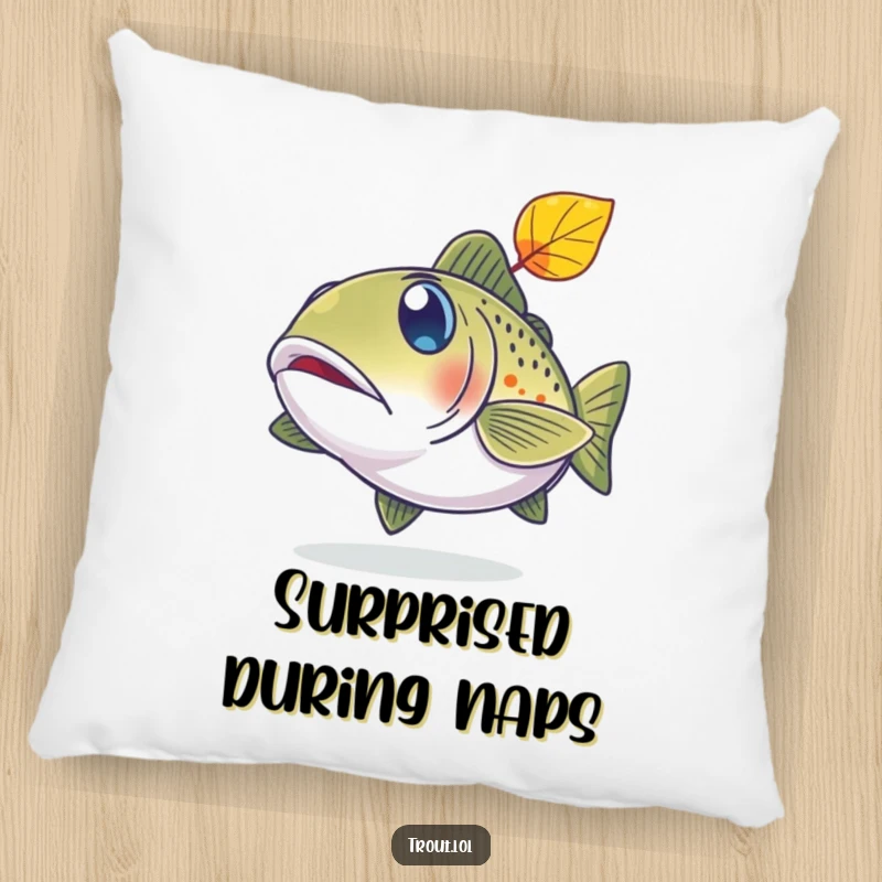 Funny pillow featuring a trout with comically wide, surprised eyes looking up at a falling leaf.