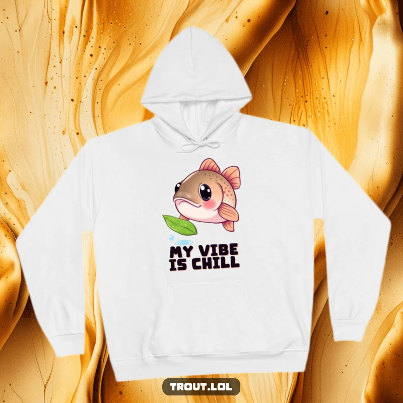 Funny hoodie showing a trout with big, inquisitive eyes, captivated by a floating leaf, a humorous depiction of gentle curiosity for outdoor lovers.