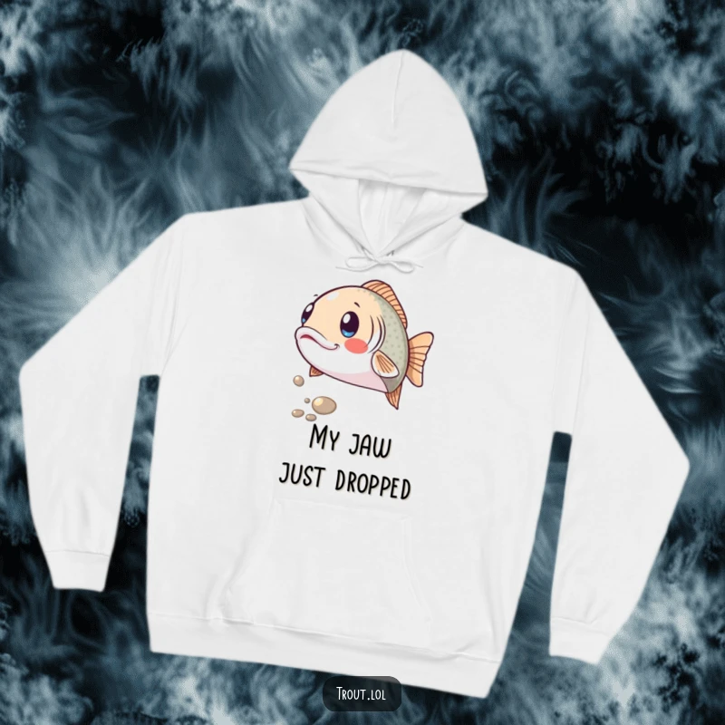Funny hoodie showing a trout with a comically surprised expression, eyes wide, as a shiny pebble rolls past, offering humorous warmth and comfort.