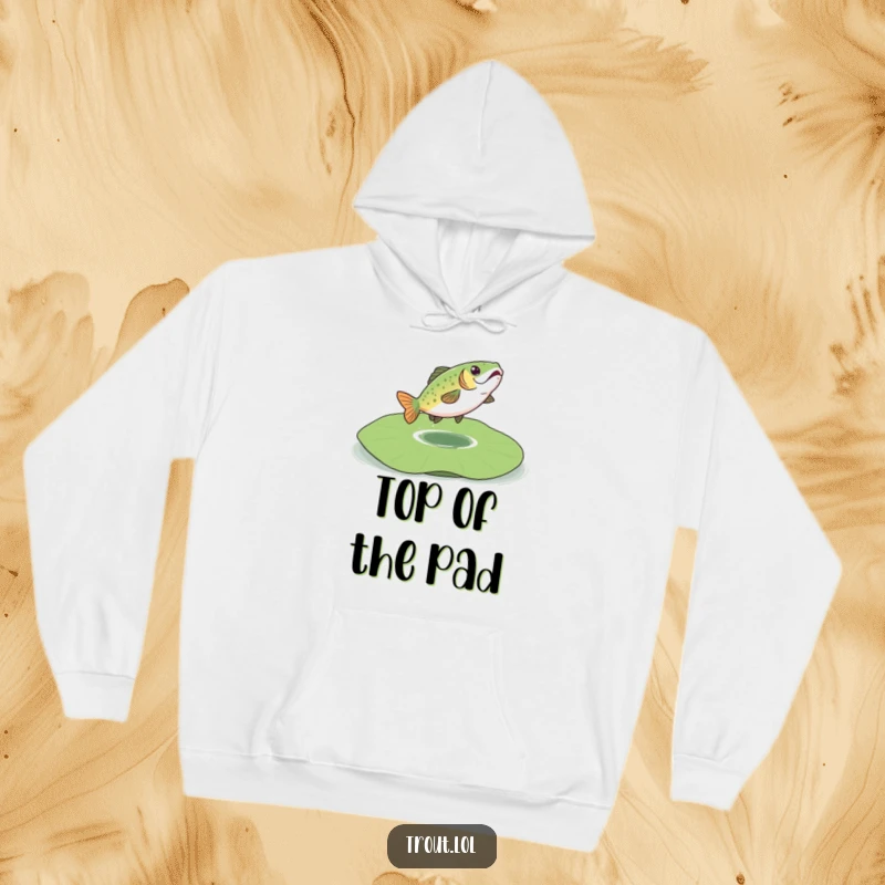 Funny hoodie depicting a cheerful trout joyfully bouncing on a large lily pad, perfect for cozy relaxation.
