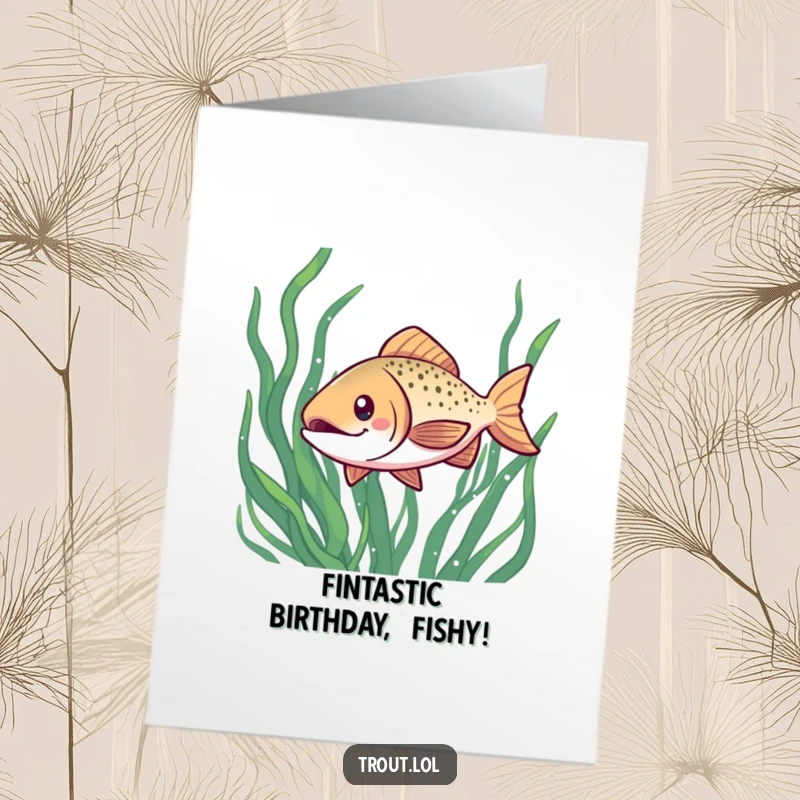 Funny Free Printable Birthday Card: a kawaii trout with a cheerful grin swims playfully through green seaweed, adding aquatic fun.