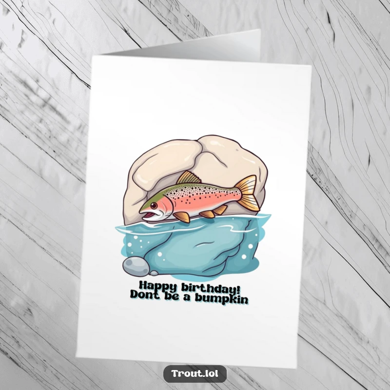 Funny Free Printable Birthday Card featuring a silly trout comically bumping its nose into a smooth underwater rock, full of playful mischief.