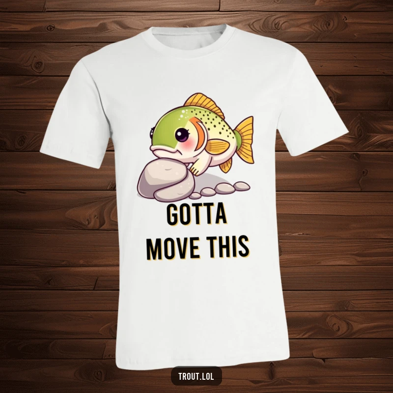 Funny t-shirt displaying a kawaii trout with a determined look, steadily nudging a smooth pebble, symbolizing perseverance.