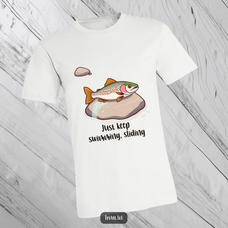 Funny T-shirt with a trout sliding down a river rock, symbolizing playful action and a love for the water.